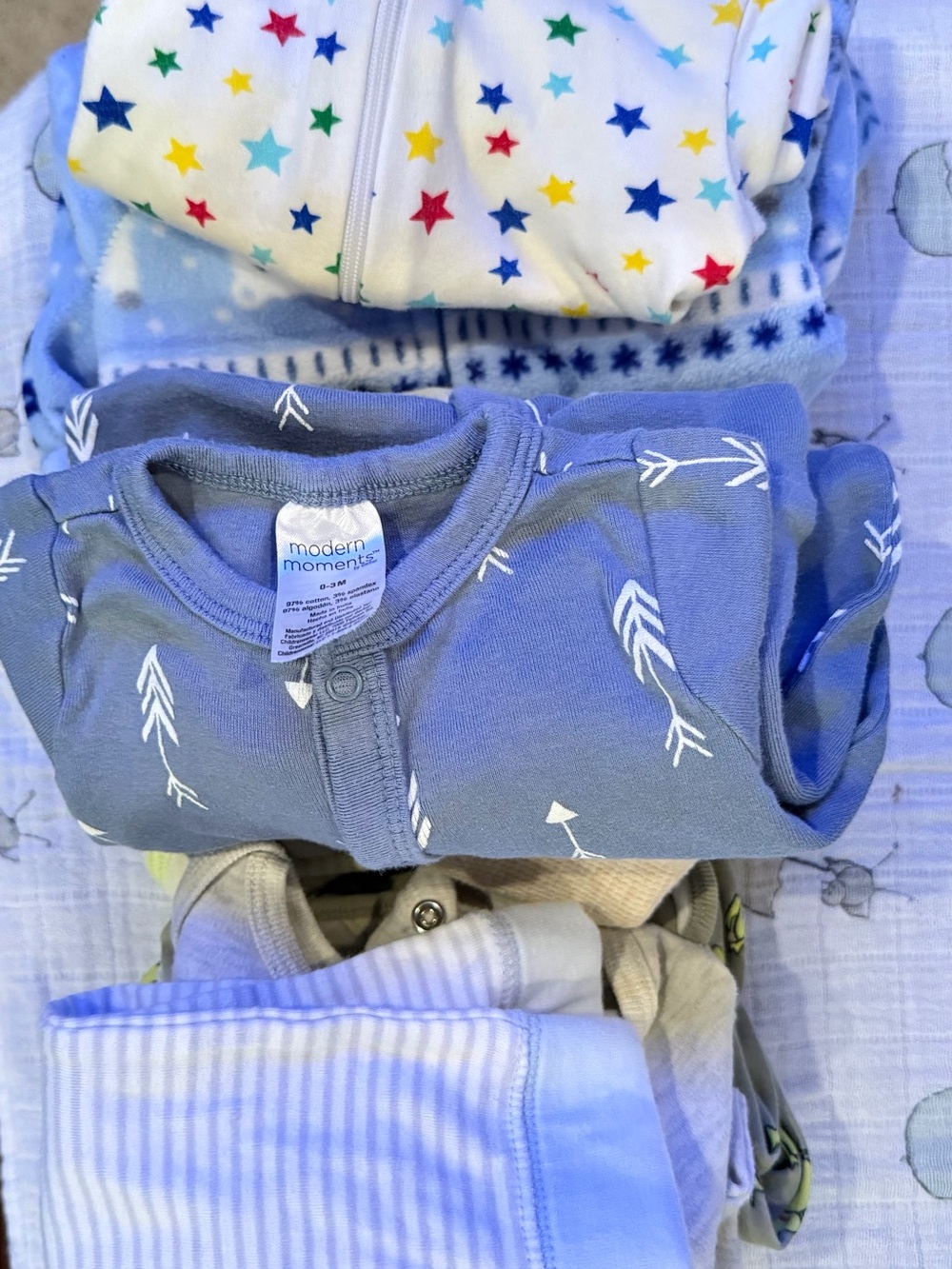 Baby boy bundle of 10 onesies sleepers.  Assorted colors and prints.
